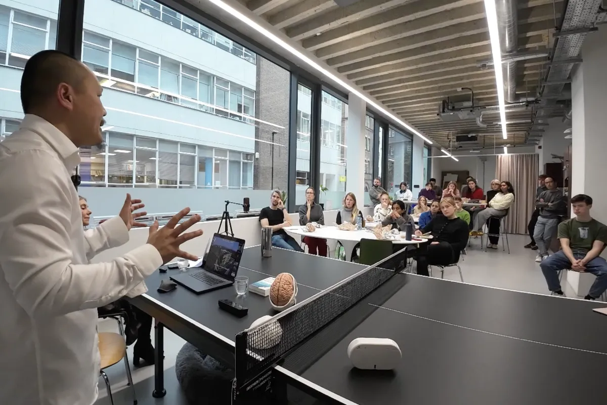 Frven presenting to architecture professionals in modern office space at Priest Goodman CPD session