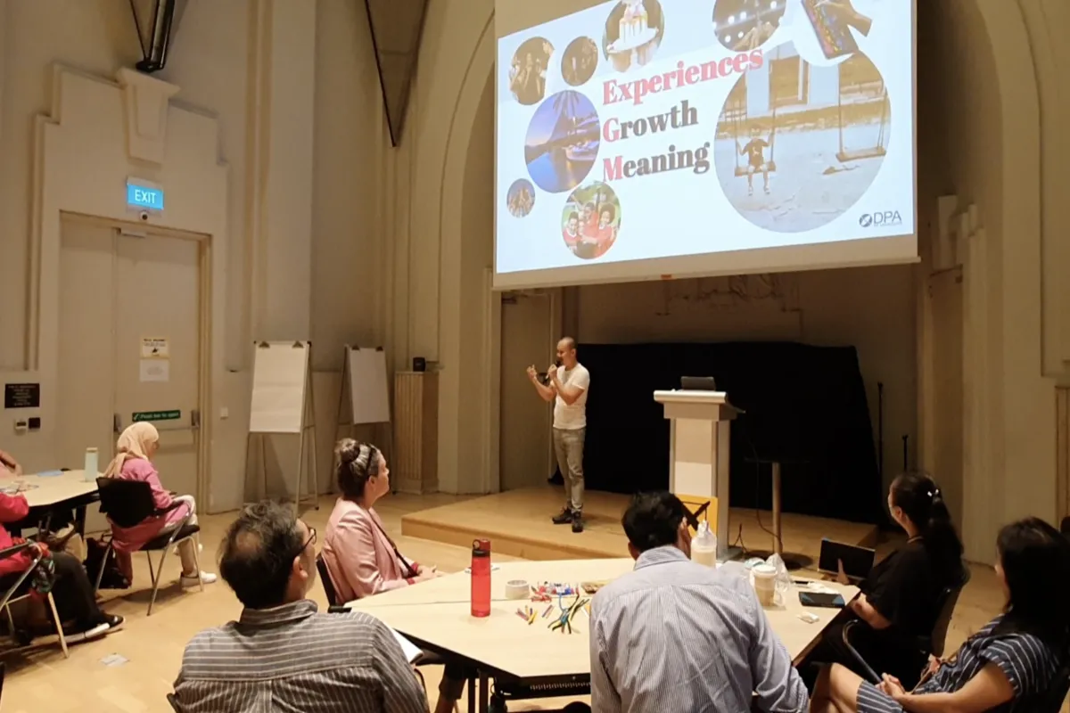 Frven presenting 'Experiences, Growth, Meaning' at SOX 2022 conference with professional audience in historic venue